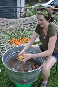 Jessie cleaning carrots.